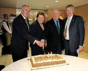 9 August 2009; Former GAA President and Mayo footballer Dr. Mick Loftus cuts a cake presented to him on the occasion of his 80th birthday with his wife Eidie, Uachtar&aacute;n Chumann L&uacute;thchleas Gael Criost&oacute;ir &Oacute; Cuana, left, and Ard Sti&uacute;rthoir Paraic Duffy, right. Dr. Mick Loftus Celebrates 80th Birthday, Croke Park, Dublin. Picture credit: Ray McManus / SPORTSFILE - read more