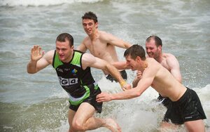 30 October 2011; Neil McGee avoids the clutches of Darren Hughes, Ciaran McKeever and Colm Begley as members of the Ireland  International Rules Series 2011 team splash about St Kilda Beach, Melbourne Bay, Australia. Picture credit: Ray McManus / SPORTSFILE - read more