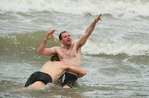 30 October 2011; Vice-captain Kieran McKeever is tackled by Darren Hughes as members of the Ireland International Rules Series 2011 team splash about on St Kilda Beach, Melbourne Bay, Australia. Picture credit: Ray McManus / SPORTSFILE - read more