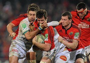 14 January 2012; Peter O'Mahony, Munster, is tackled by Yannick Caballero, left, and Pierre Bernard, Castres Olympique. Heineken Cup, Pool 1, Round 5, Munster v Castres Olympique, Thomond Park, Limerick. Picture credit: Diarmuid Greene / SPORTSFILE - read more