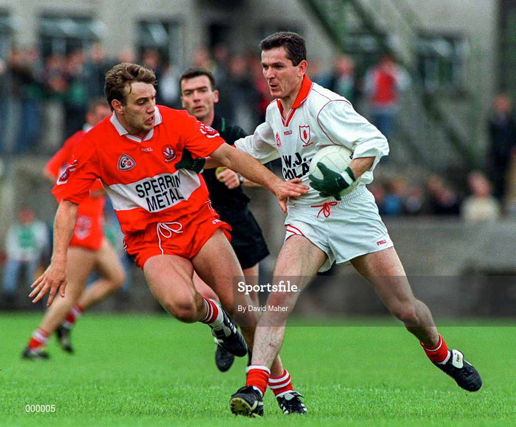 29 June 1997; Adrian Cush of Tyrone in action against Karl Diamond of Derry during the Ulster GAA Football Senior Championship Semi-Final match between Tyrone and Derry at St. Tiernach's Park, Clones, Monaghan. Photo by David Maher/Sportsfile