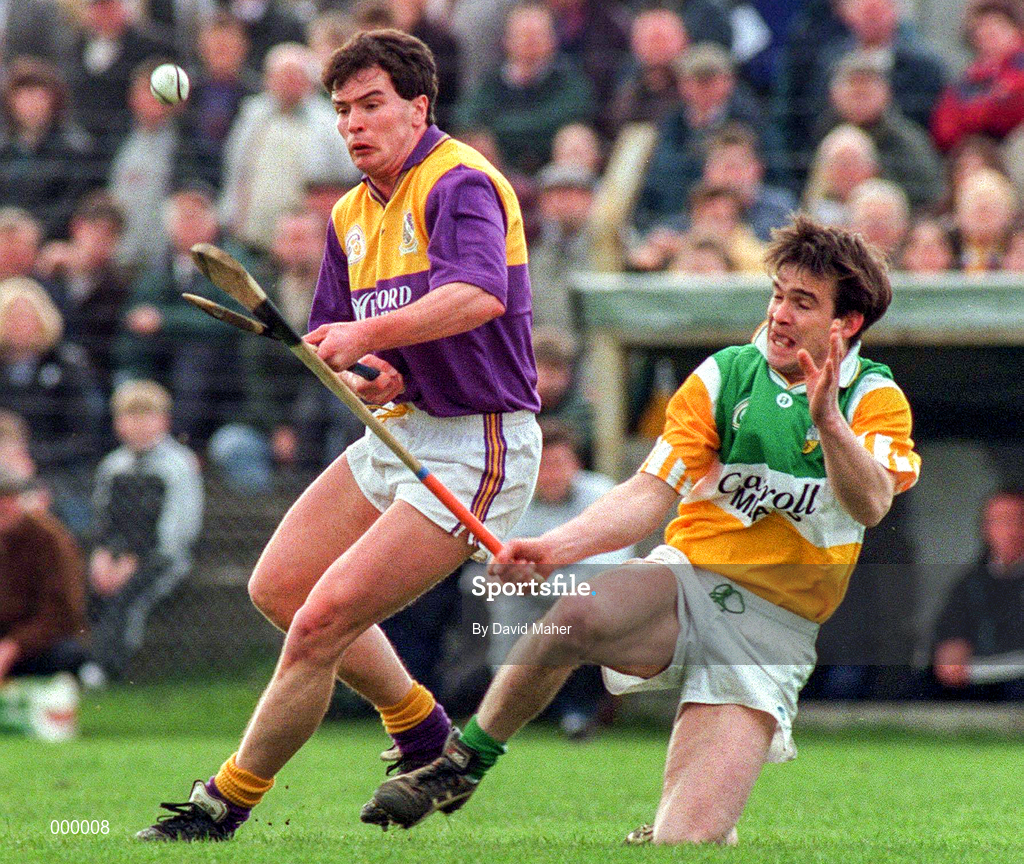 23 March 1997; Adrian Fenlon of Wexford in action against Johnny Pilkington of Offaly during the National Hurling League Division 1 match between Offaly and Wexford at St. Brendan's Park in Birr, Offaly. Photo by David Maher/Sportsfile