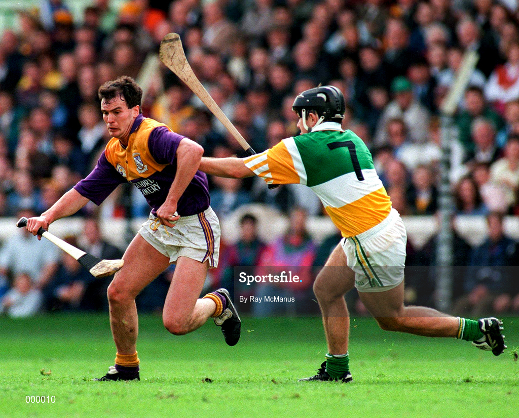 22 June 1997; Adrian Fenlon of Wexford in action against Colm Cassidy of Offaly during the GAA Leinster Senior Hurling Championship Semi-Final match between Wexford and Offaly at Croke Park in Dublin. Photo by Ray McManus/Sportsfile