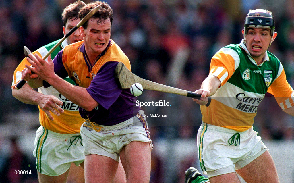 22 June 1997; Adrian Fenlon of Wexford in action against Colm Cassidy, right, and Martin Hanamy of Offaly during the GAA Leinster Senior Hurling Championship Semi-Final match between Wexford and Offaly at Croke Park in Dublin. Photo by Ray McManus/Sportsfile