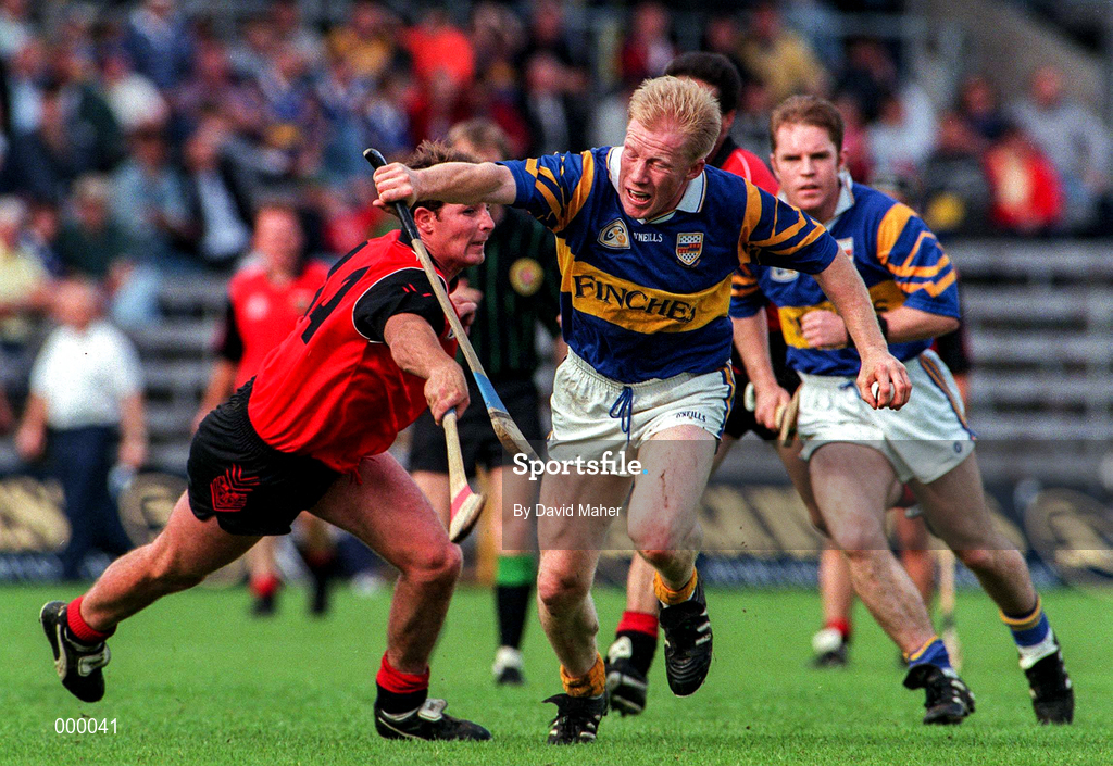 26 July 1997; Aidan Ryan of Tipperary in action against Jerome McCrickard of Down during the GAA All-Ireland Senior Hurling Championship Quarter-Final match between Tipperary and Down at St. Tiernach's Park in Clones, Monaghan. Photo by David Maher/Sportsfile