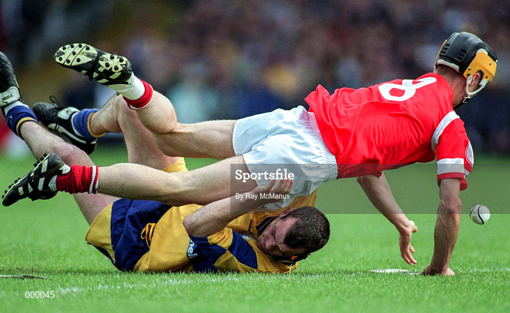 8 June 1997; Alan Cummins of Cork in action against Ollie Baker of Clare during the GAA Munster Senior Hurling Championship Semi-Final match between Clare and Cork at Gaelic Grounds, Limerick. Photo by Ray McManus/Sportsfile