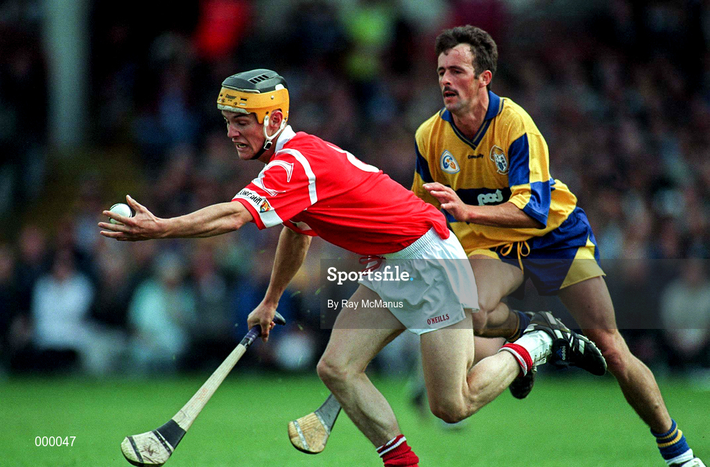 8 June 1997; Alan Cummins of Cork in action against PJ O'Connell of Clare during the GAA Munster Senior Hurling Championship Semi-Final match between Clare and Cork at the Gaelic Grounds in Limerick. Photo by Ray McManus/Sportsfile