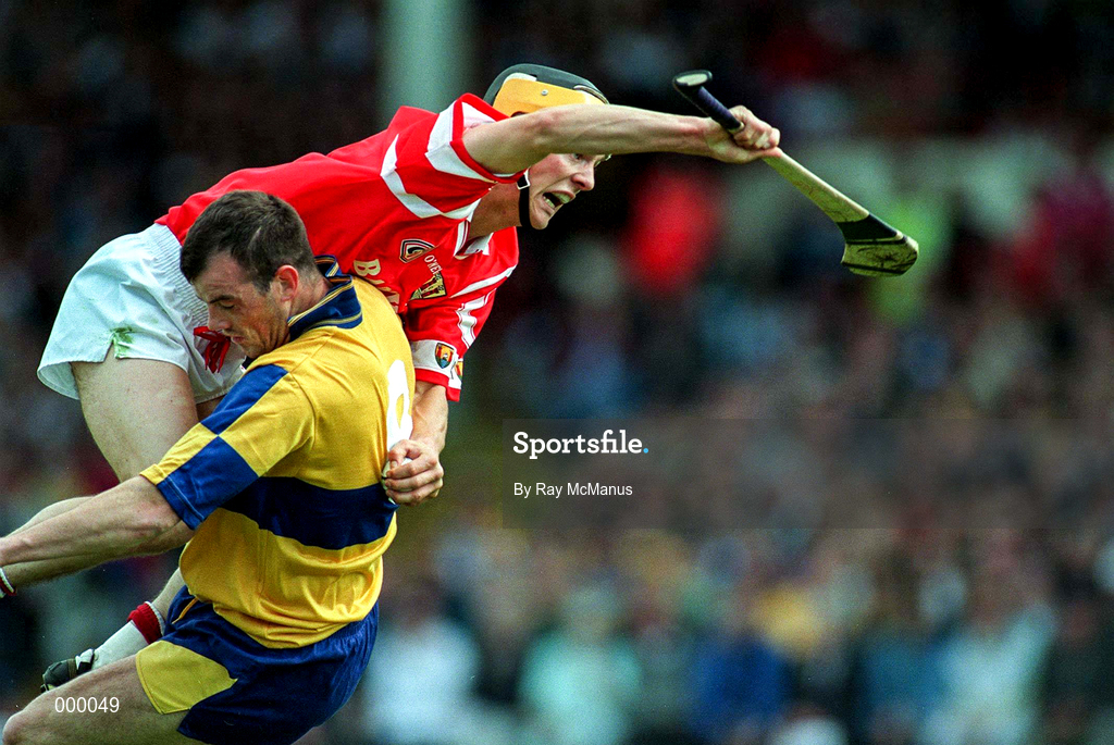 8 June 1997; Alan Cummins of Cork in action against Ollie Baker of Clare during the GAA Munster Senior Hurling Championship Semi-Final match between Clare and Cork at the Gaelic Grounds in Limerick. Photo by Ray McManus/Sportsfile