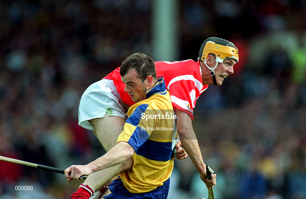 8 June 1997; Alan Cummins of Cork in action against Ollie Baker of Clare during the GAA Munster Senior Hurling Championship Semi-Final match between Clare and Cork at the Gaelic Grounds in Limerick. Photo by Ray McManus/Sportsfile