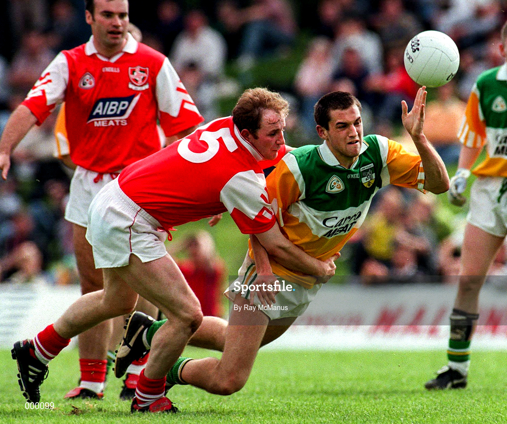 29 June 1997; Barry malone of Offaly is tackled by Colin Kelly of Louth during the Leinster GAA Senior Football Championship Semi-Final match between Offaly and Louth at Páirc Tailteann in Navan, Co Meath. Photo by Ray McManus/Sportsfile