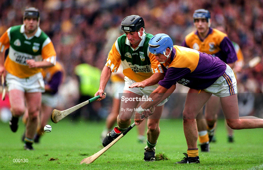 22 June 1997; Billy Dooley of Offaly in action against Eugene Furlong of Wexford during the GAA Leinster Senior Hurling Championship Semi-Final match between Wexford and Offaly at Croke Park in Dublin. Photo by Ray McManus/Sportsfile