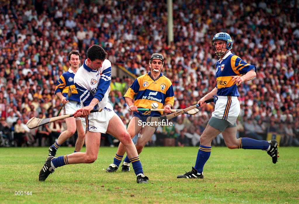 6 July 1997; Tipperary 'keeper Brendan Cummins clears downfield from Stephen McNamara of Clare and Noel Sheehy of Tipperary during the GAA Munster Senior Hurling Championship Final match between Clare and Tipperary at Páirc Uí Chaoimh in Cork. Photo by Ray McManus/Sportsfile