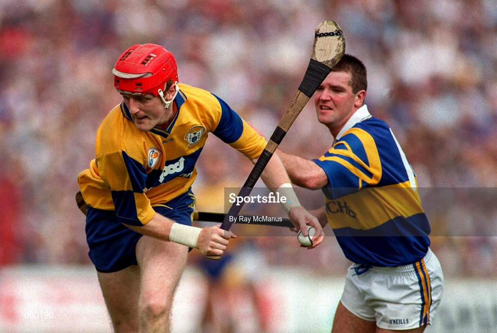 6 July 1997; Brian Lohan of Clare in action against Michael Cleary of Tipperary during the GAA Munster Senior Hurling Championship Final match between Clare and Tipperary at Páirc Uí Chaoimh in Cork. Photo by Ray McManus/Sportsfile