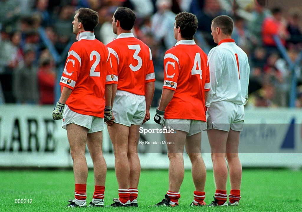 22 June 1997; Cork players, from left, Brian Murphy, Mark O'Connor, Eoin Sexton and Kevin O'Dwyer stand for the national anthem prior to the GAA Munster Senior Football Championship Semi-Final match between Clare and Cork at Cusack Park in Ennis, Co Clare. Photo by Brendan Moran/SportsfileE