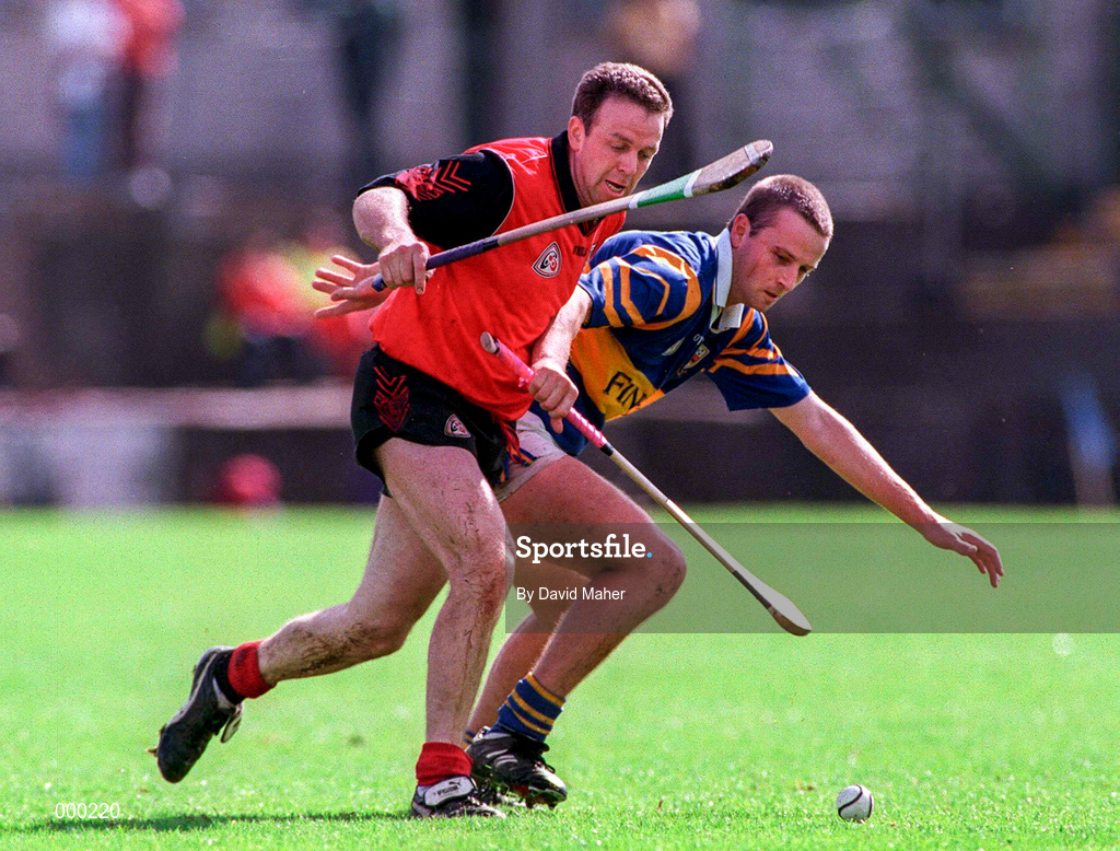 26 July 1997; Brian O'Meara of Tipperary in a tussle for possession with Kevin Coulter of Down during the GAA All-Ireland Senior Hurling Championship Quarter-Final match between Tipperary and Down at St. Tiernach's Park in Clones, Monaghan. Photo by David Maher/Sportsfile