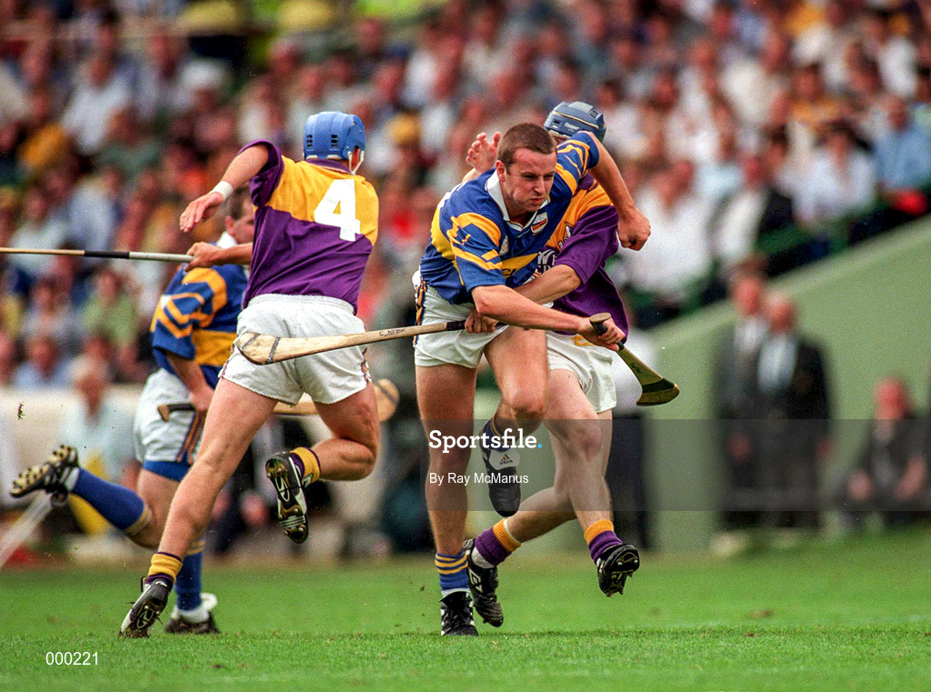 17 August 1997; Brian O'Meara of Tipperary in action against Colm Kehoe and Eugene Furlong, 4, of Wexford during the GAA All-Ireland Senior Hurling Championship Semi-Final match between Tipperary and Wexford at Croke Park in Dublin. Photo by Ray McManus/Sportsfile