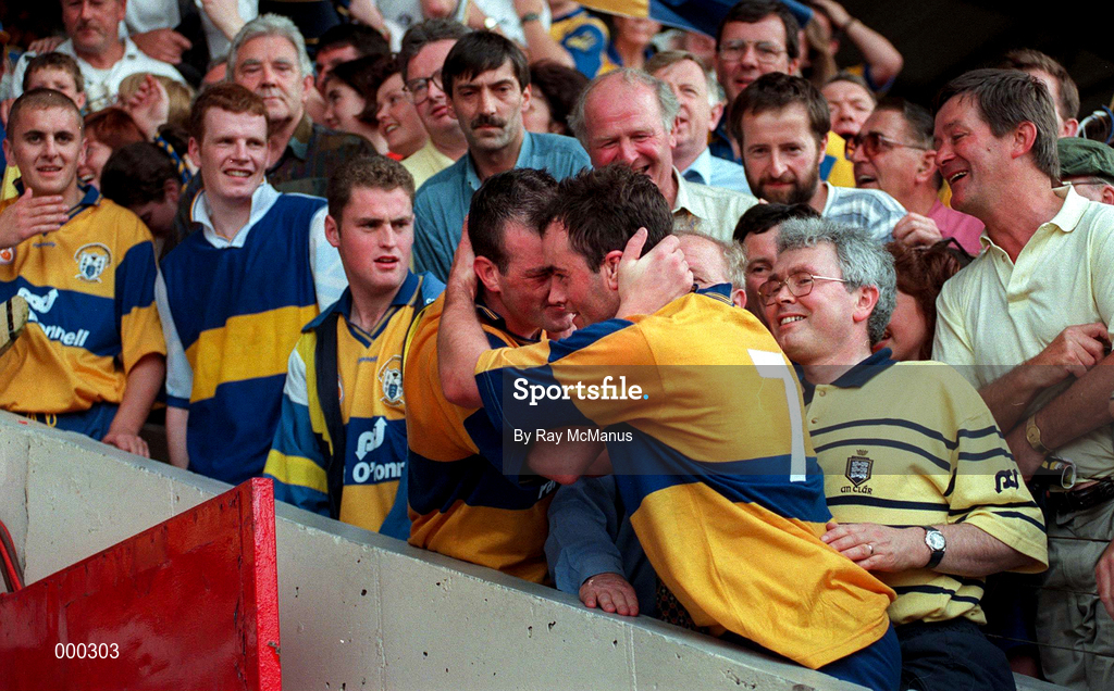14 September 1997; Clare's Ollie Baker has a word with captain Anthony Daly as Daly goes up the steps to collect the trophy following Clare's victory in the Guinness All Ireland Hurling Final match between Clare and Tipperary at Croke Park in Dublin. Photo by Ray McManus/Sportsfile