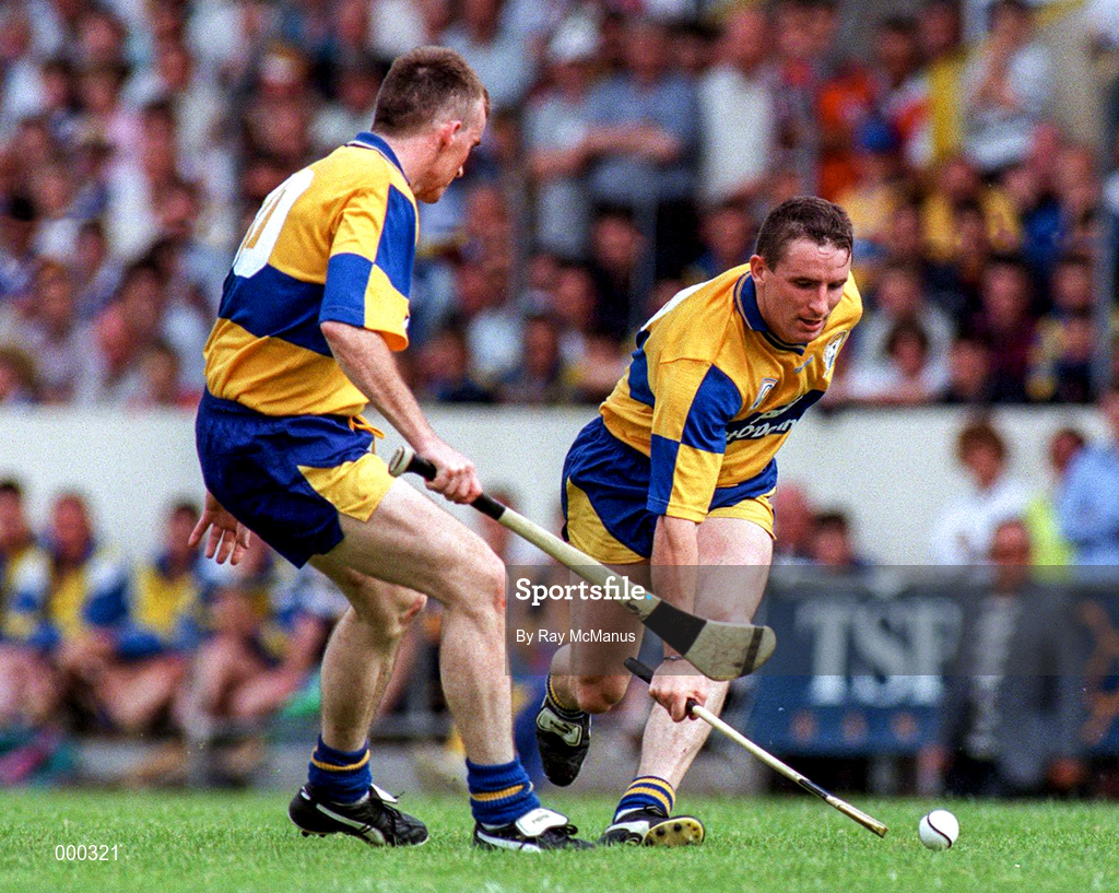 10 May 1997; Colin Lynch is supported by team-mate Fergus Tuohy of Clare during the National Hurling League Division 1 match between Clare and Tipperary at Cusack Park in Ennis, Clare. Photo by Ray McManus/Sportsfile