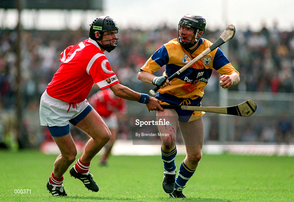8 June 1997; Conor Clancy of Clare holds off the challenge of John O'Driscoll of Cork during the GAA Munster Senior Hurling Championship Semi-Final match between Clare and Cork at the Gaelic Grounds in Limerick. Photo by Brendan Moran/Sportsfile