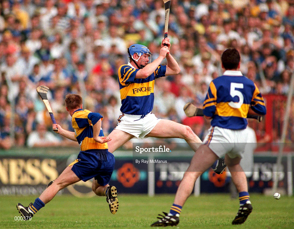 6 July 1997; Conor Gleeson of Tipperary in action against James O'Connor, left, and Raymie Ryan of Clare during the GAA Munster Senior Hurling Championship Final match between Clare and Tipperary at Páirc Uí Chaoimh in Cork. Photo by Ray McManus/Sportsfile