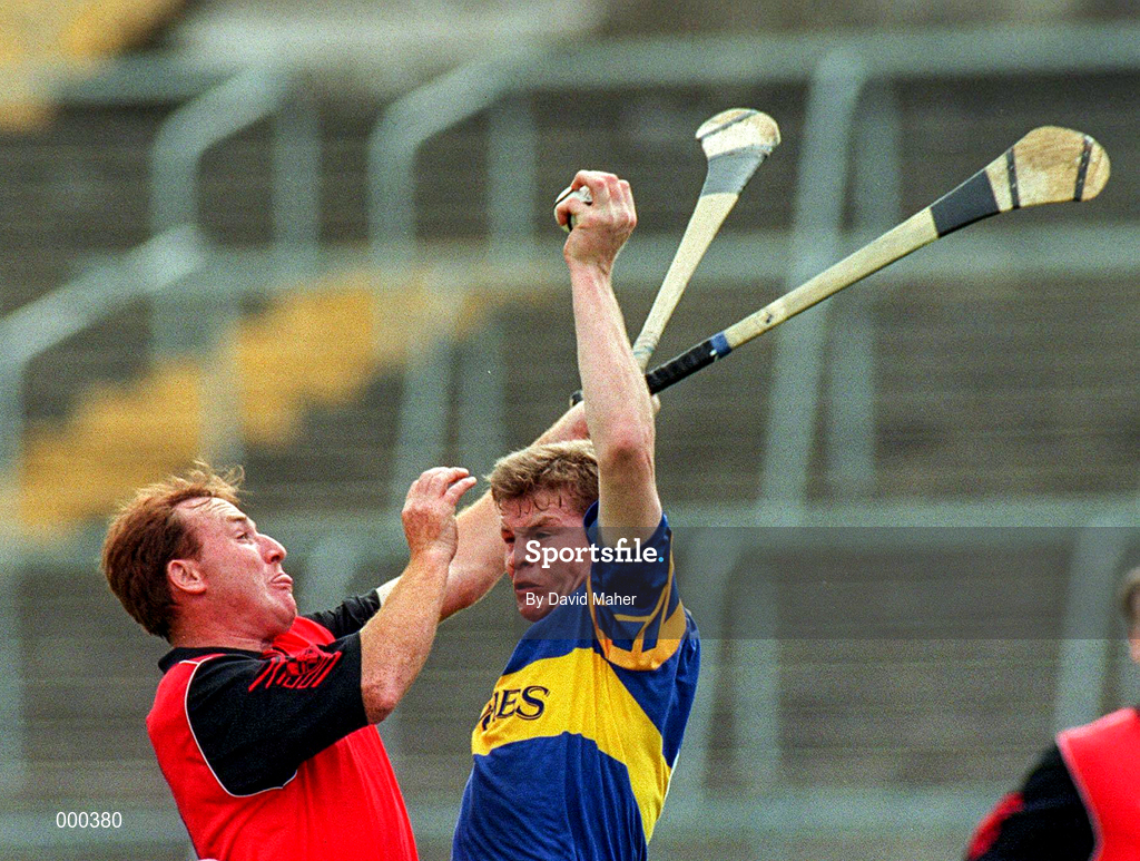 26 July 1997; Conor Gleeson of Tipperary in action against Gary Savage of Down during the GAA All-Ireland Senior Hurling Championship Quarter-Final match between Tipperary and Down at St. Tiernach's Park in Clones, Monaghan. Photo by David Maher/Sportsfile
