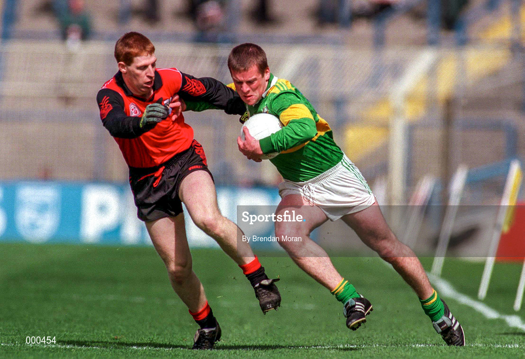 6 April 1997; Dara O'Cinneide of Kerry, gets past the challenge of Liam Howlett of Down during the National League Quarter Final at Croke Park in Dublin. Photo by Brendan Moran/Sportsfile