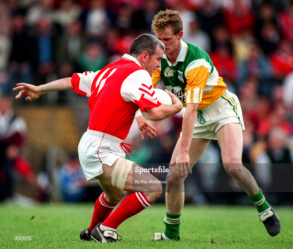 29 June 1997; David Reilly of Louth holds off the challenge of Ronan Mooney of Offaly during the Leinster GAA Senior Football Championship Semi-Final match between Offaly and Louth at Páirc Tailteann in Navan, Co Meath. Photo by Ray McManus/Sportsfile