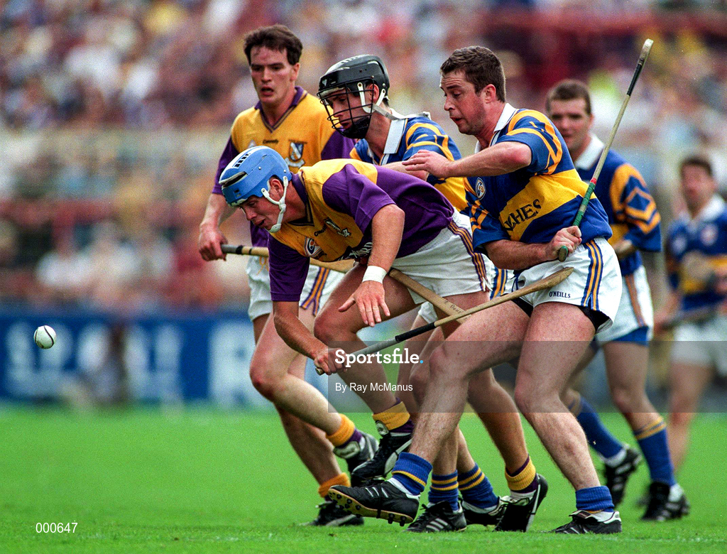 17 August 1997; Eugene Furlong of Wexford, in a race for possession with Brian O'Meara, right, and Thomas Dunne of Tipperary during the GAA All-Ireland Senior Hurling Championship Semi-Final match between Tipperary and Wexford at Croke Park in Dublin. Photo by Ray McManus/Sportsfile