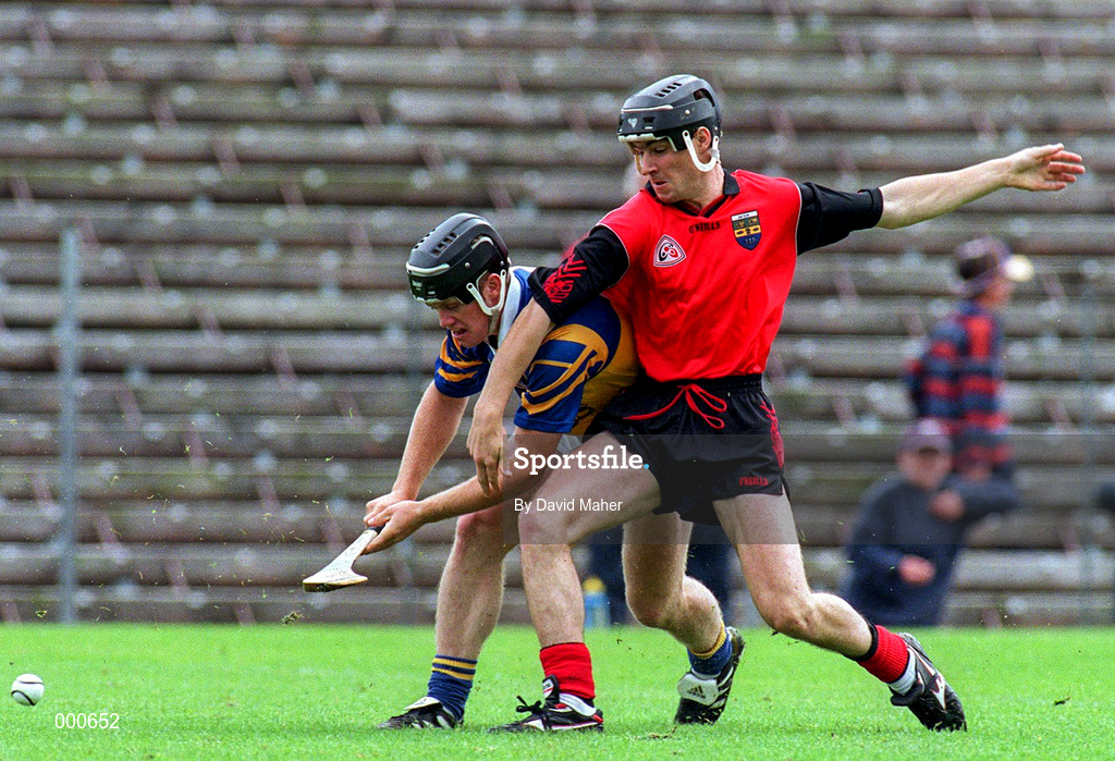 26 July 1997; Eugene O'Neill of Tipperary in a tussle for possession with Stephen Murray of Down during the GAA All-Ireland Senior Hurling Championship Quarter-Final match between Tipperary and Down at St. Tiernach's Park in Clones, Monaghan. Photo by David Maher/Sportsfile