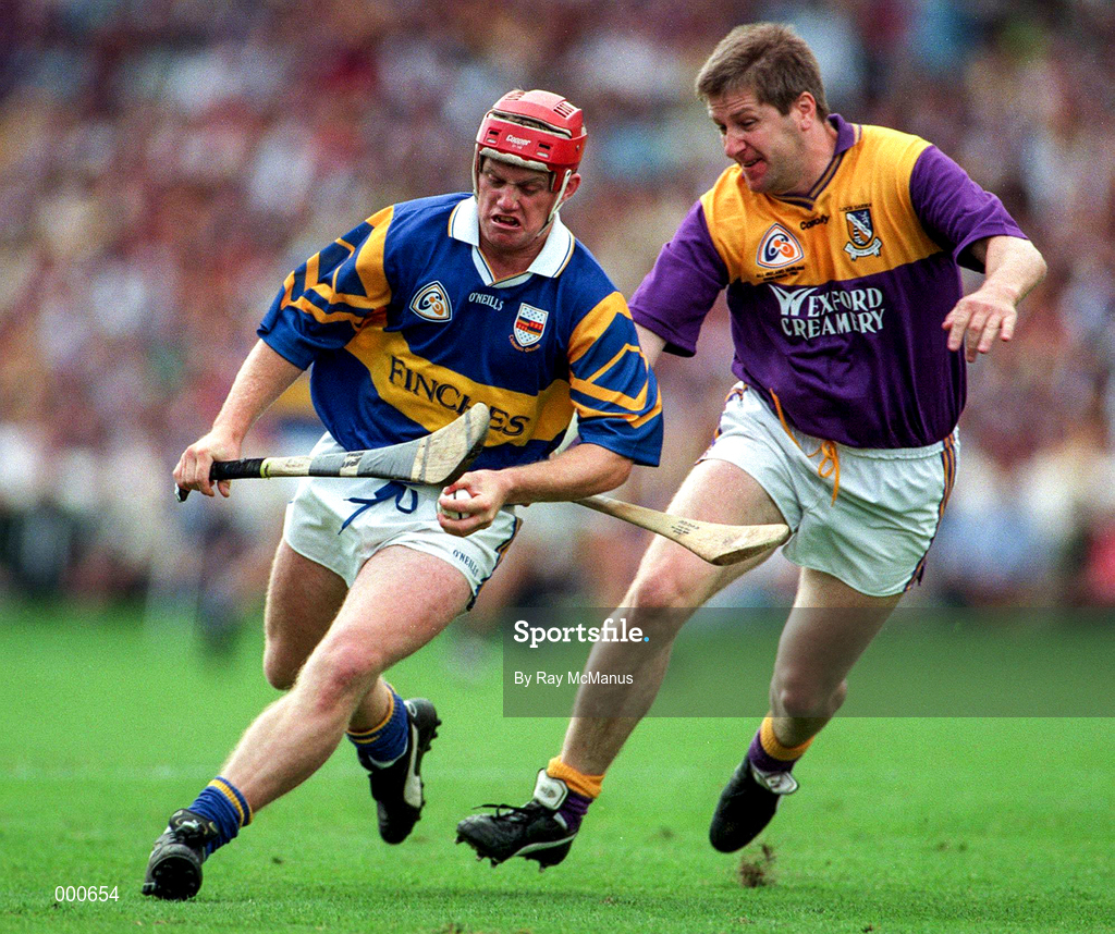 17 August 1997; Eugene O'Neill of Tipperary in action against Ger Cush of Wexford during the GAA All-Ireland Senior Hurling Championship Semi-Final match between Tipperary and Wexford at Croke Park in Dublin. Photo by Ray McManus/Sportsfile
