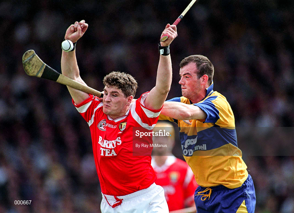8 June 1997; Fergal McCormack of Cork in action against Ollie Baker of Clare during the GAA Munster Senior Hurling Championship Semi-Final match between Clare and Cork at the Gaelic Grounds in Limerick. Photo by Ray McManus/Sportsfile