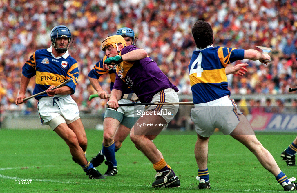 17 August 1997; Garry Laffan of Wexford in action against, from left, Colm Bonner, Noel Sheehy and Michael Ryan, 4, of Tipperary during the GAA All-Ireland Senior Hurling Championship Semi-Final match between Tipperary and Wexford at Croke Park in Dublin. Photo by David Maher/Sportsfile
