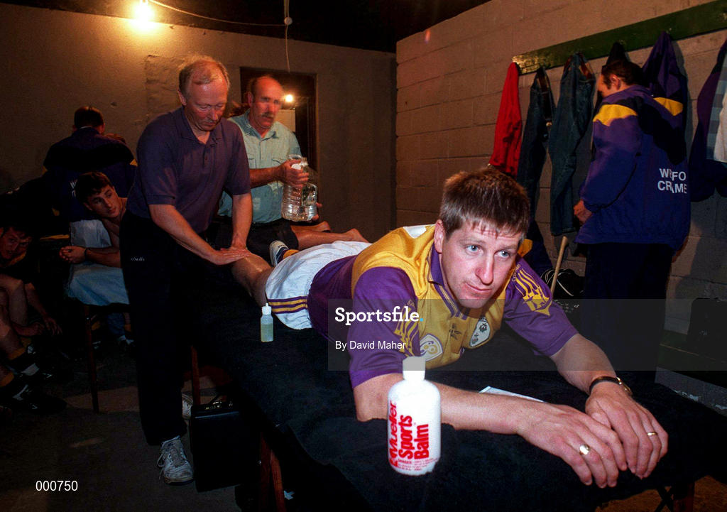 17 August 1997; Ger Cush of Wexford receives attention from Pat Whitney, Physical Therapist, prior to the GAA All-Ireland Senior Hurling Championship Semi-Final match between Tipperary and Wexford at Croke Park in Dublin. Photo by David Maher/Sportsfile