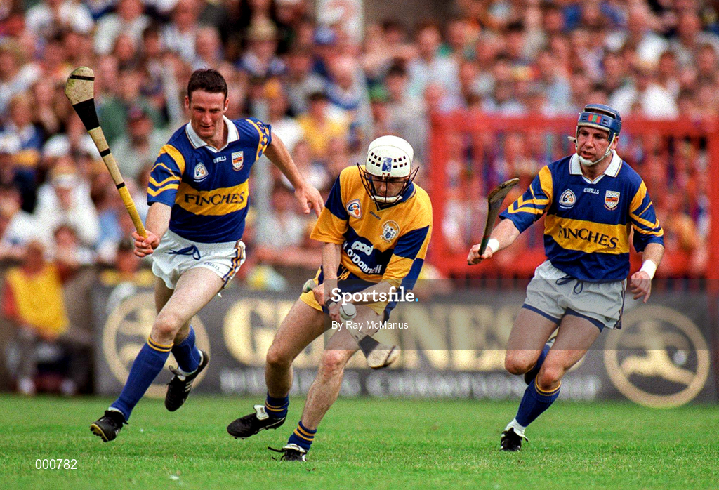 14 September 1997; Ger O'Loughlin of Clare in action against Aiden Butker, left, and John Leahy of Tipperary during the Guinness All Ireland Hurling Final match between Clare and Tipperary at Croke Park in Dublin. Photo by Ray McManus/Sportsfile