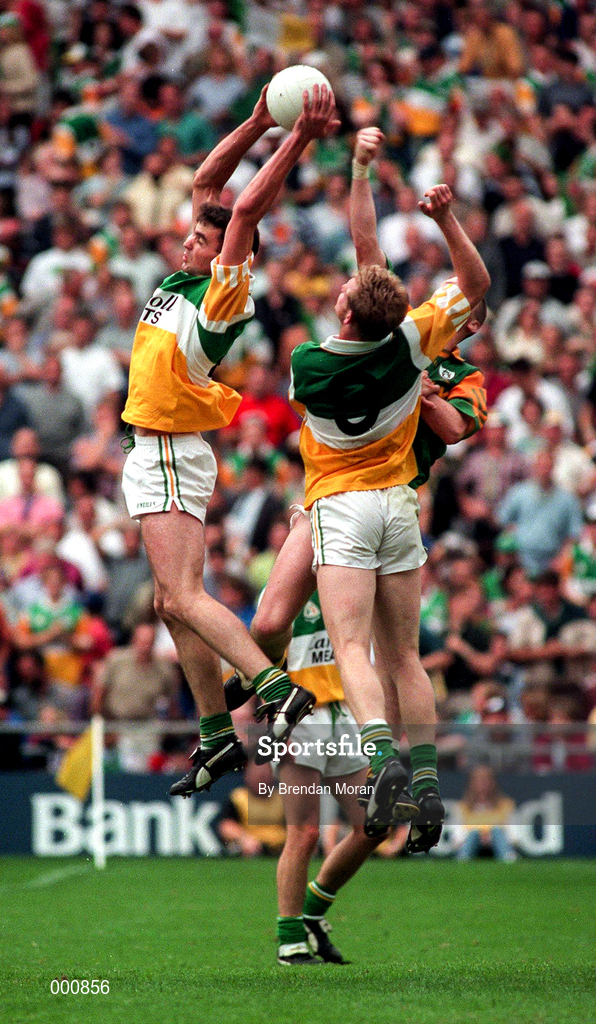 16 August 1997; James Grennan of Offaly in gets above team mate Ronan Mooney, 9, and Jimmy McGuinness of Meath during the Leinster GAA Senior Football Championship Final match between Meath and Offaly at Croke Park in Dublin. Photo by Brendan Moran/Sportsfile