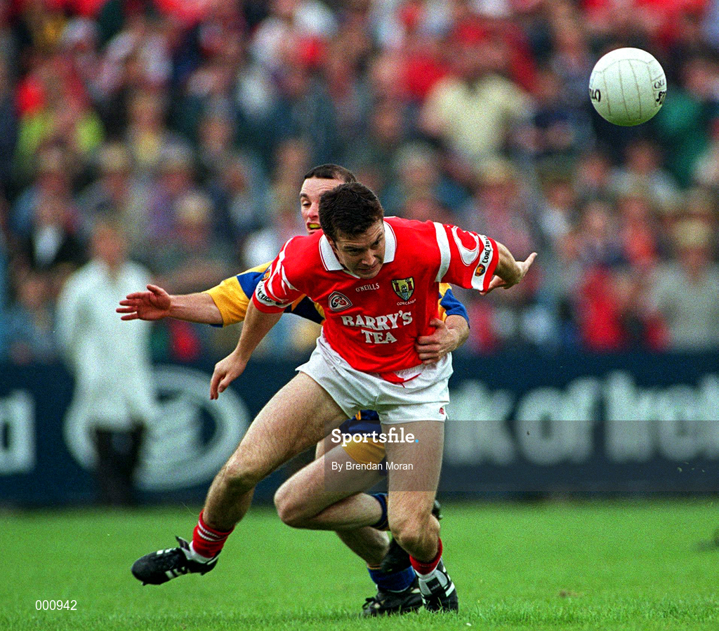 22 June 1997; Joe Kavanagh of Cork in action against Aodan McCartaigh of Clare during the GAA Munster Senior Football Championship Semi-Final match between Clare and Cork at Cusack Park in Ennis, Co Clare. Photo by Brendan Moran/Sportsfile