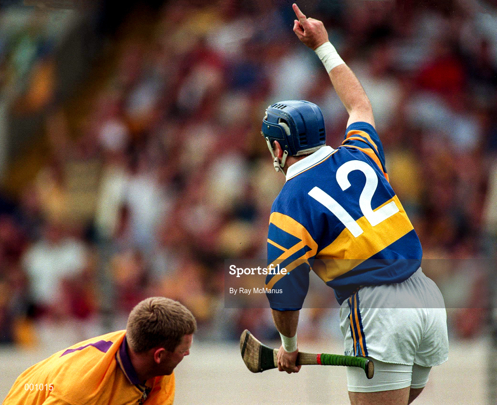 17 August 1997; John Leahy of Tipperary celebrates his goal as Damean Fitzhenry of Wexford looks on during the GAA All-Ireland Senior Hurling Championship Semi-Final match between Tipperary and Wexford at Croke Park in Dublin. Photo by Ray McManus/Sportsfile