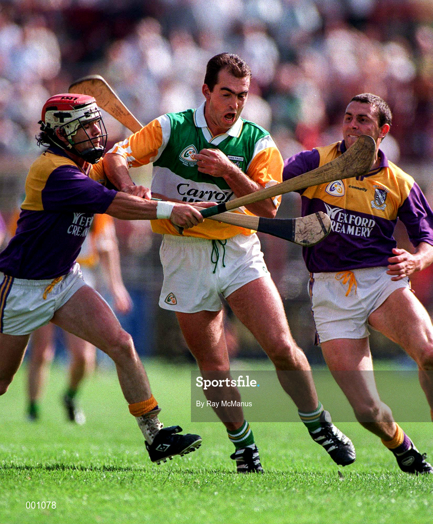 22 June 1997; Johnny Dooley of Offaly in action against Sean Flood, left, with, Larry O'Gorman of Wexford during the GAA Leinster Senior Hurling Championship Semi-Final match between Wexford and Offaly at Croke Park in Dublin. Photo by Ray McManus/Sportsfile