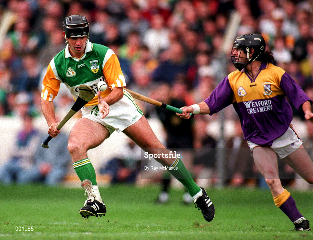 22 June 1997; Johnny Dooley of Offaly in action against Sean Flood of Wexford during the GAA Leinster Senior Hurling Championship Semi-Final match between Wexford and Offaly at Croke Park in Dublin. Photo by Ray McManus/Sportsfile