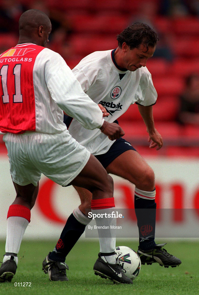 25 July 1998; Dean Holdsworth of Bolton Wanderers in action against Leon Braithwaite of St. Patrick's Athletic during the Club Friendly between St. Patrick's Athletic and Bolton Wanderers at Richmond Park in Dublin. Photo by Brendan Moran/Sportsfile