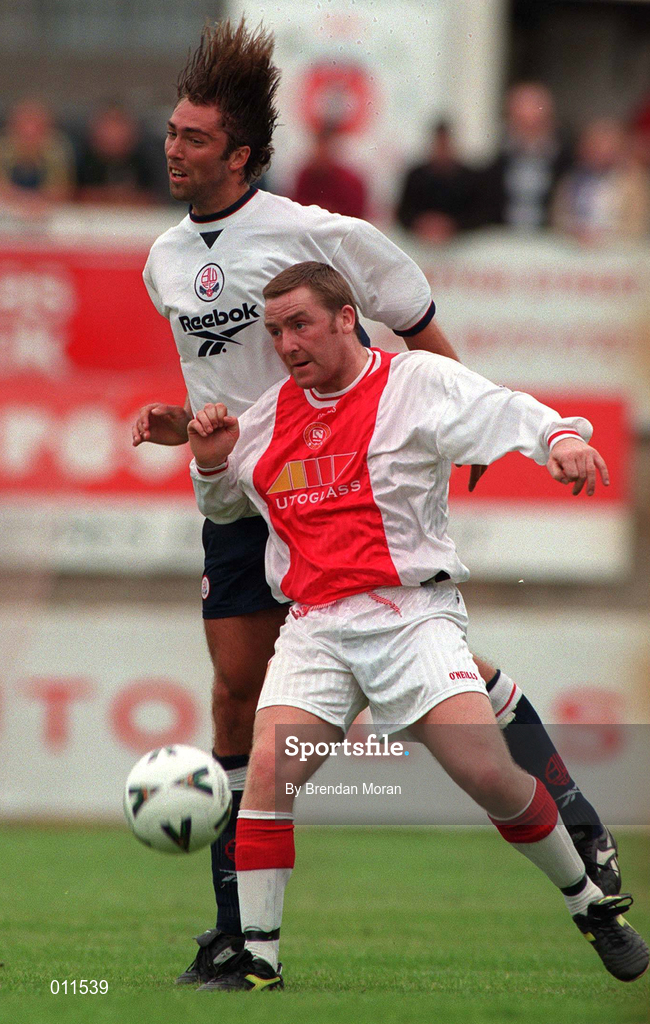 25 July 1998; Jason Byrne of St. Patrick's Athletic in action against Greg Strong of Bolton Wanderers during the Club Friendly between St. Patrick's Athletic and Bolton Wanderers at Richmond Park in Dublin. Photo by Brendan Moran/Sportsfile