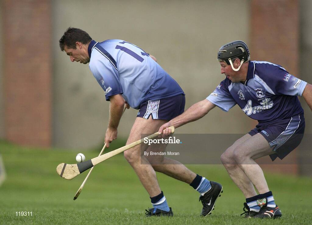 26 July 2003; Former Republic of Ireland soccer international Niall Quinn playing for Dublin, in action against Martin Kelly, Galway (dark blue). Aoife McGrane - King Benefit match, Dublin v Galway Minor Hurling teams of 1983, St Vincent's GAA Club Grounds, Marino, Dublin. Picture credit; Brendan Moran / SPORTSFILE *EDI*