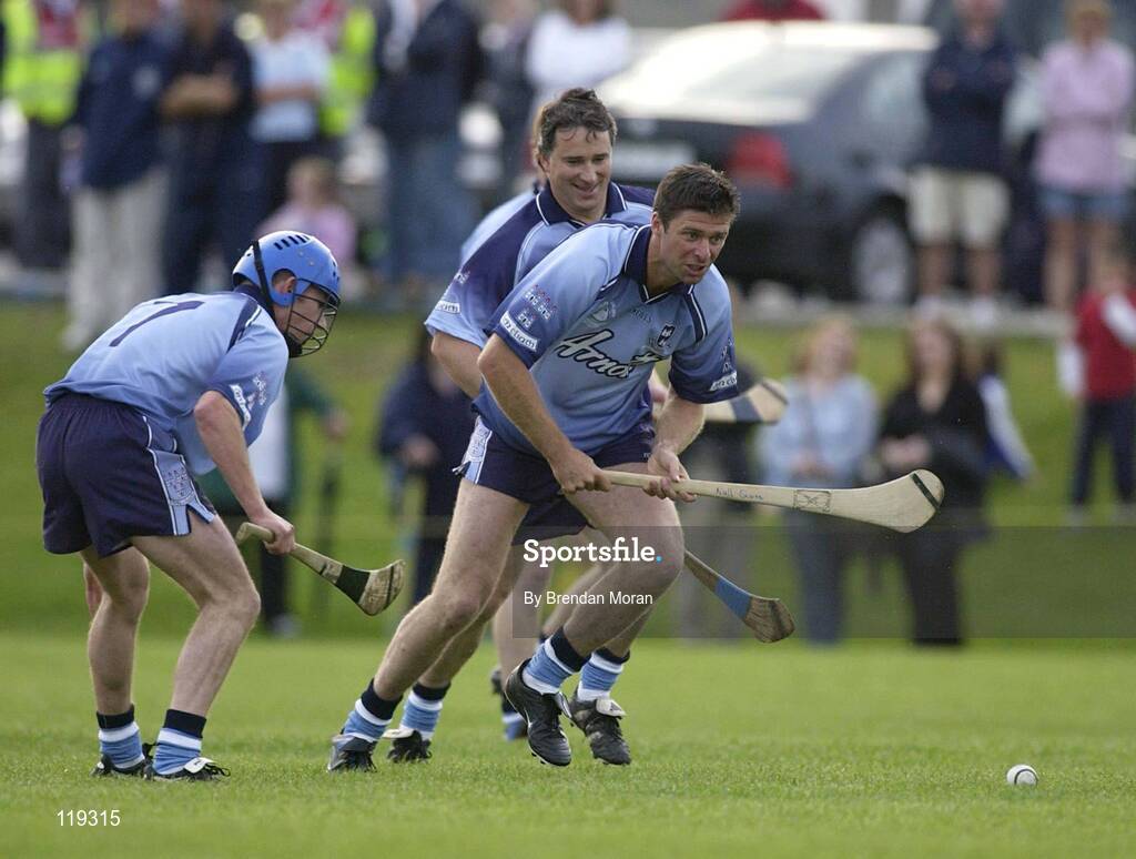 26 July 2003; Former Republic of Ireland soccer international Niall Quinn, playing for Dublin, in action against Tomas Mulcahy, playing for Galway (dark blue). Aoife McGrane - King Benefit match, Dublin v Galway Minor Hurling teams of 1983, St Vincent's GAA Club Grounds, Marino, Dublin. Picture credit; Brendan Moran / SPORTSFILE *EDI*