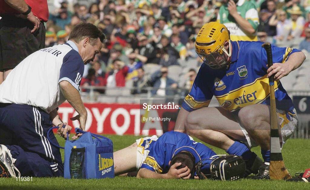 27 July 2003; Thomas Dunne of Tipperary lies injured as he is attended to by the team doctor during the Guinness All-Ireland Senior Hurling Championship Quarter Final match between Offaly and Tipperary at Croke Park in Dublin. Photo by Pat Murphy / Sportsfile
