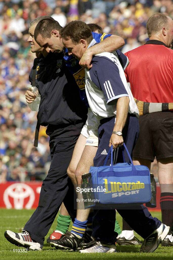 27 July 2003; Tipperary's Thomas Dunne is helped from the pitch after an injury during the Guinness All-Ireland Senior Hurling Championship Quarter Final match between Offaly and Tipperary at Croke Park in Dublin. Photo by Pat Murphy / Sportsfile
