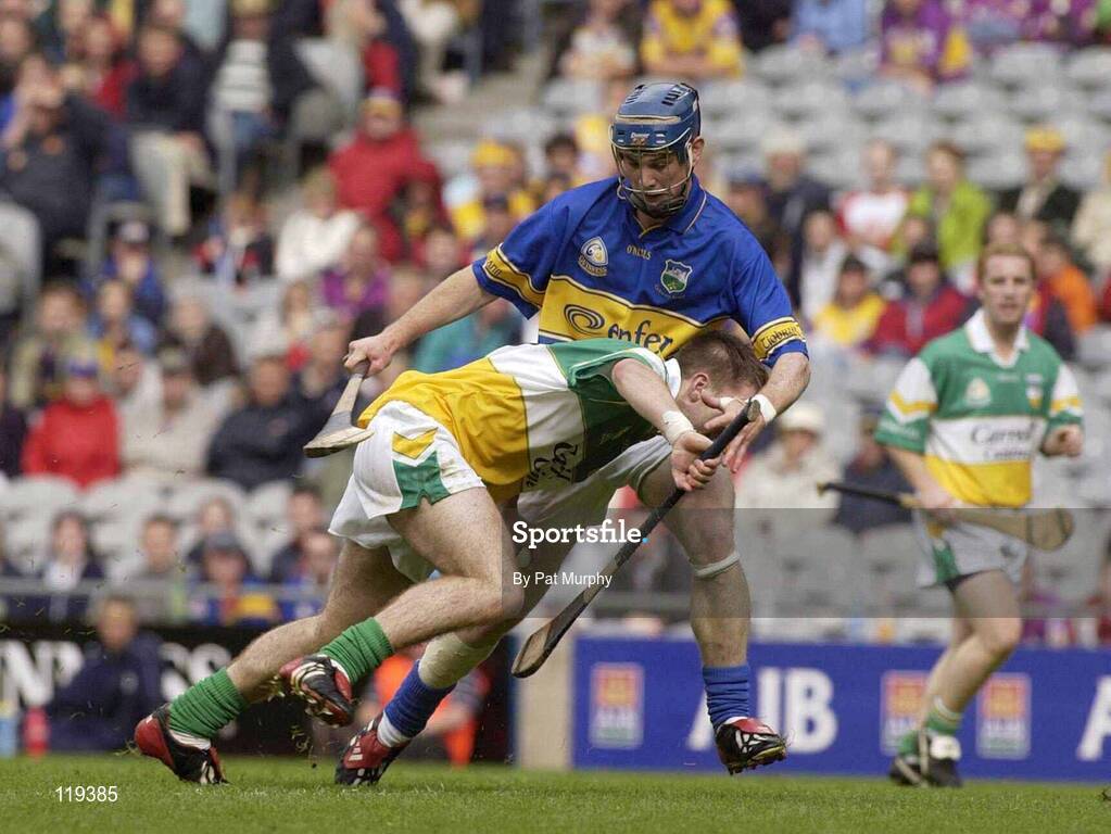 27 July 2003; Brian Carroll of Offaly in action against Martin Maher of Tipperary during the Guinness All-Ireland Senior Hurling Championship Quarter Final match between Offaly and Tipperary at Croke Park in Dublin. Photo by Pat Murphy / Sportsfile