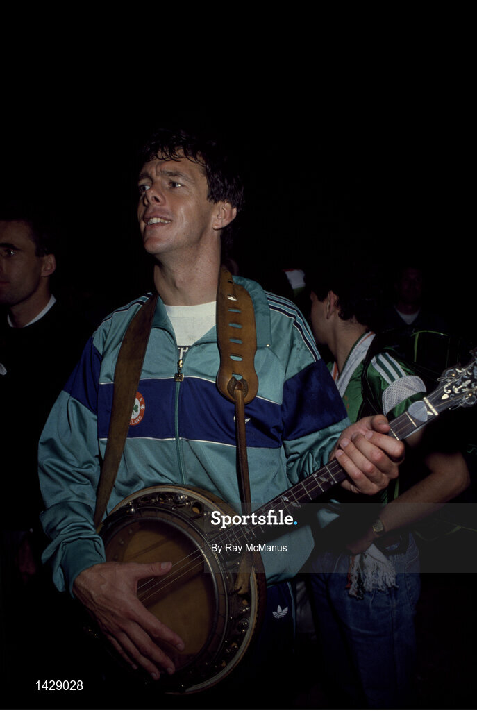 15 November 1989; David O'Leary of Republic of Ireland plays a banjo while celebrating qualification for the World Cup after the FIFA World Cup Qualifying match between Matla and Republic of Ireland at the Ta'Qali Stadium in Valetta, Malta. Photo by Ray McManus/Sportsfile
