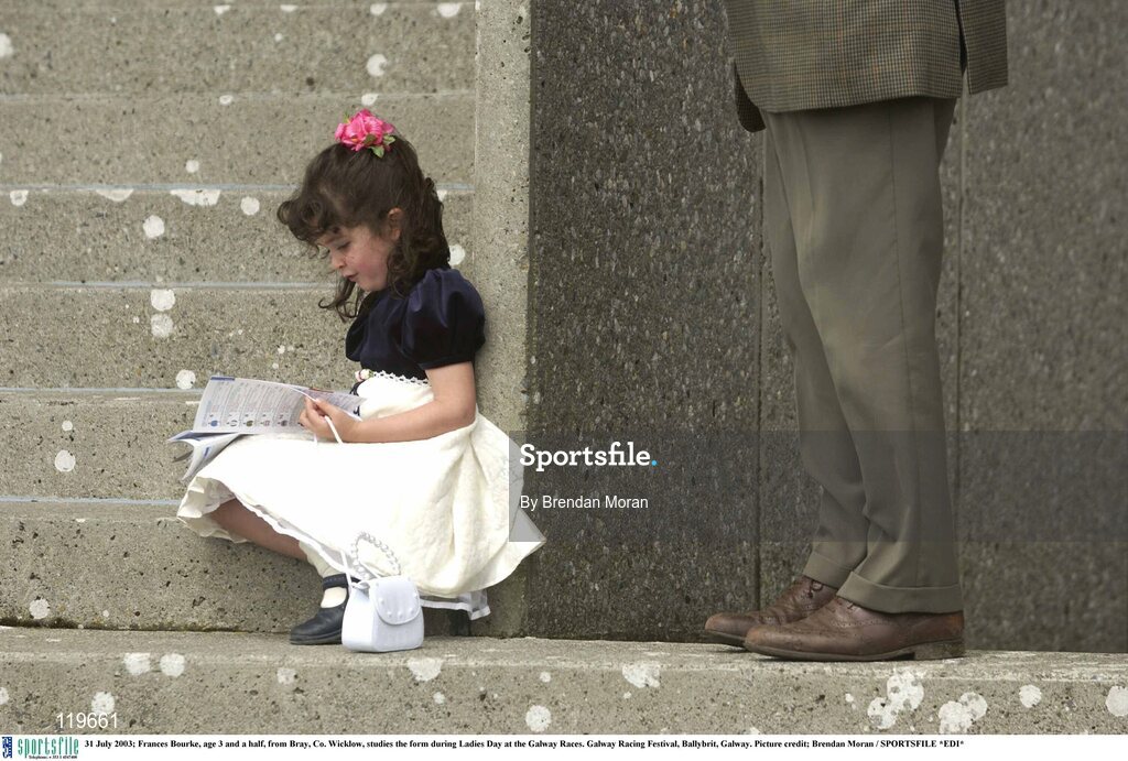 31 July 2003; Frances Bourke, age 3 and a half, from Bray, Co. Wicklow, studies the form during Ladies Day at the Galway Races. Galway Racing Festival, Ballybrit, Galway. Picture credit; Brendan Moran / SPORTSFILE *EDI*