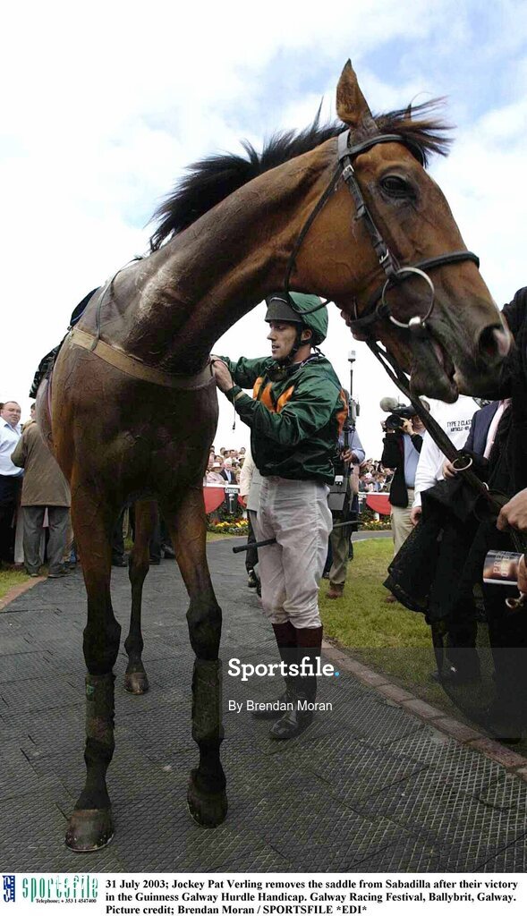 31 July 2003; Jockey Pat Verling removes the saddle from Sabadilla after their victory in the Guinness Galway Hurdle Handicap. Galway Racing Festival, Ballybrit, Galway. Picture credit; Brendan Moran / SPORTSFILE *EDI*