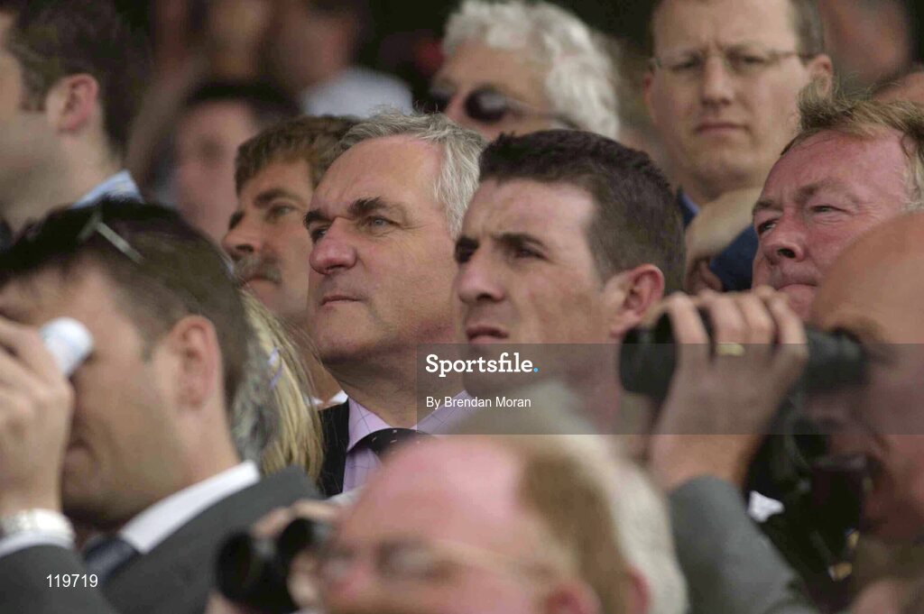 30 July 2003; An Taoiseach Bertie Ahern T.D. and Minister for Sport and Tourism John O'Donoghue watch the HP Software Publishing Services Handicap. Galway Racing Festival, Ballybrit, Galway. Picture credit; Brendan Moran / SPORTSFILE *EDI*